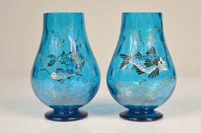 Lot 29 - A pair of early 20th Century continental blue glass hand painted baluster shaped vases