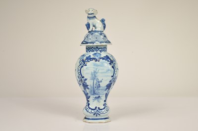 Lot 58 - A pair of Dutch Delft baluster vase and covered