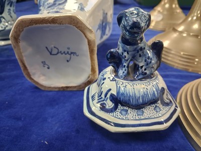 Lot 58 - A pair of Dutch Delft baluster vase and covered