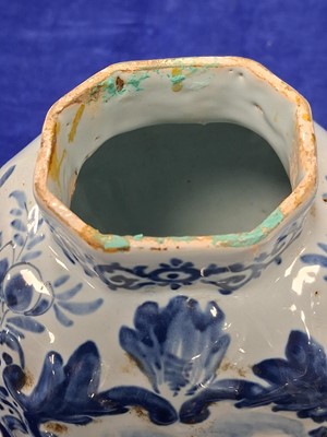 Lot 58 - A pair of Dutch Delft baluster vase and covered