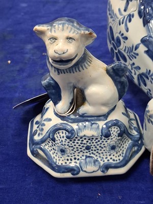Lot 58 - A pair of Dutch Delft baluster vase and covered