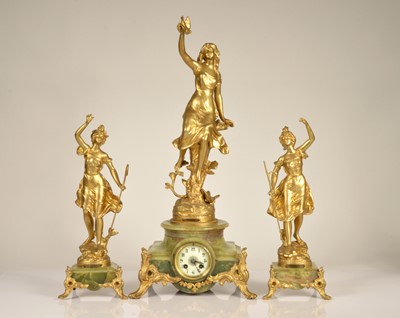 Lot 99 - A late 19th century French clock garniture