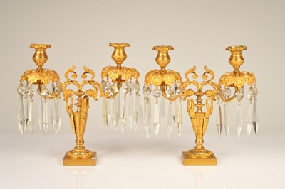 Lot 136 - A pair of gilt metal twin branch candelabra