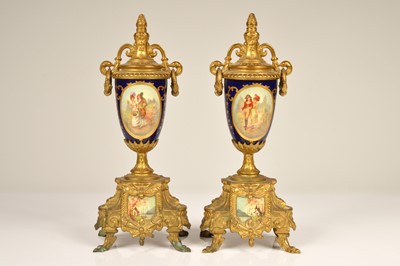 Lot 138 - A pair of 20th Century transfer printed continental spelter mounted urns