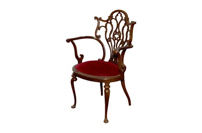 Lot 295 - An Edwardian stained beech fret carved style armchair