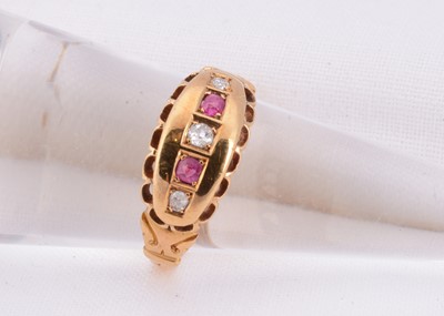 Lot 2 - A 18ct gold diamond & ruby boat shape dress ring