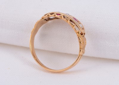 Lot 2 - A 18ct gold diamond & ruby boat shape dress ring