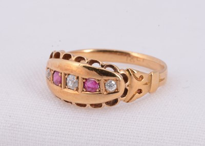 Lot 2 - A 18ct gold diamond & ruby boat shape dress ring