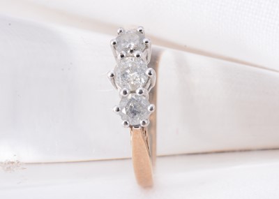 Lot 15 - A 9ct gold three stone diamond ring