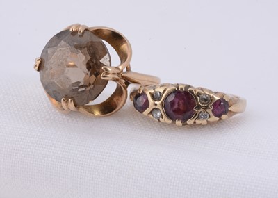 Lot 18 - A 9ct gold ruby & diamond boat dress ring & 9ct gold quartz dress ring
