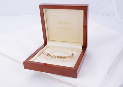 Lot 20 - A 9ct gold diamond set bangle