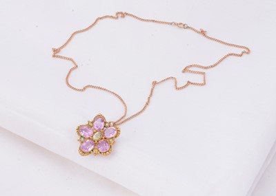 Lot 21 - A 15ct gold flower Topaz & peridot set pendant necklace