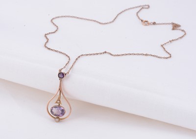 Lot 22 - An Edwardian 9ct gold amethyst teardrop pendant