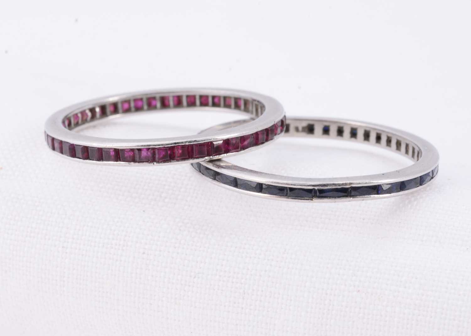 Lot 30 - Two full eternity gem set white metal rings