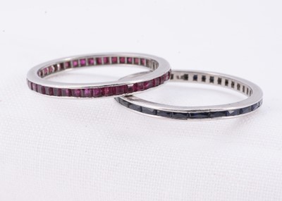 Lot 30 - Two full eternity gem set white metal rings