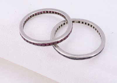 Lot 30 - Two full eternity gem set white metal rings