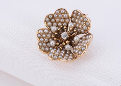 Lot 35 - A 14ct gold seed pearl & diamond flower brooch/pendant
