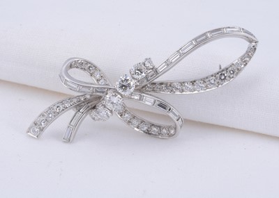 Lot 41 - A platinum diamond set bow brooch