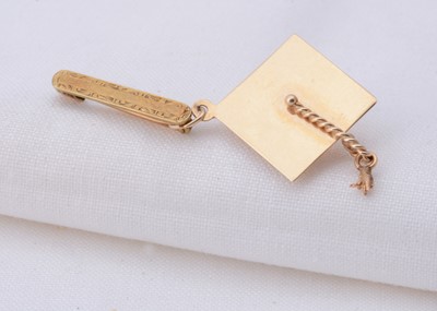 Lot 42 - A yellow metal Morta board hat & brooch