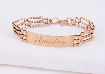 Lot 50 - A 9ct gold ID bracelet with gate links