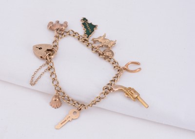 Lot 52 - A 9ct gold charm bracelet