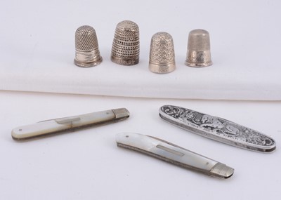 Lot 55 - A Charles Horner thimble together with three silver thimbles & two silver & mother of pearl fruit knifes