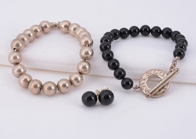 Lot 56 - A "Tiffany & Co" silver bead bracelet & onyx bead toggle bracelet