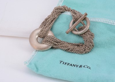 Lot 58 - A "Tiffany & Co" silver multi strand chain bracelet with circle motif centre