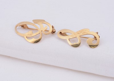 Lot 65 - Two 14k gold initial brooches