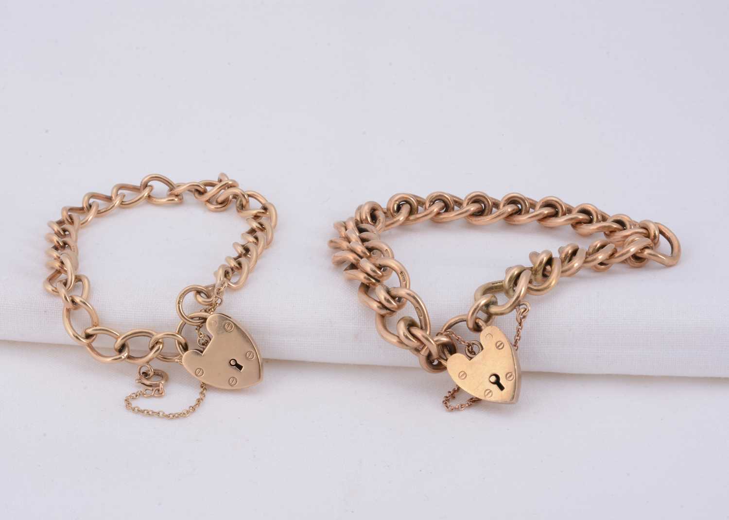 Lot 79 - Two 9ct gold curb link chain padlock bracelets