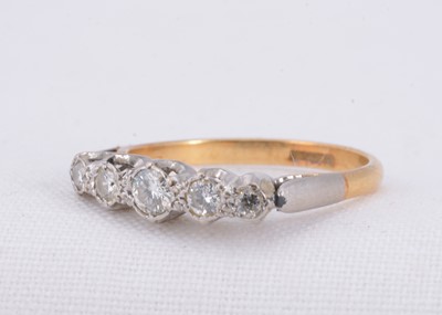 Lot 82 - A 18ct & platinum five stone diamond ring