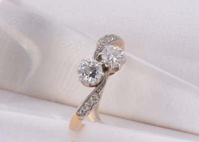 Lot 83 - A 18ct gold diamond crossover ring