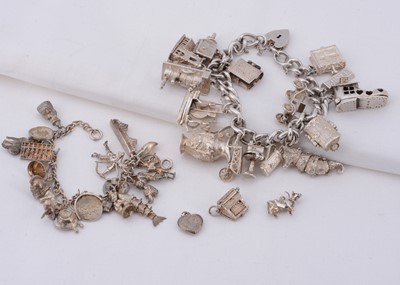 Lot 95 - Two silver charm bracelets with multiple charms