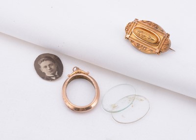Lot 135 - A 9ct gold Victorian brooch, a 9ct gold photo pendant, 9ct yellow gold Victorian brooch with hidden compartment, 4 cm x 2.5 cm, 9ct surround photo pendant, insert 2 cm x 3 cm, 8.3g