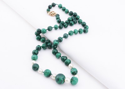 Lot 136 - A string of graduated malachite beads with six graduated pearls alternating in the middle of the necklace