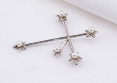 Lot 142 - A Mikimoto white metal southern cross brooch set with pearls