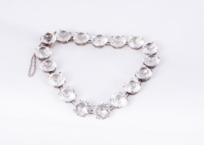 Lot 153 - An Art Deco silver set colourless paste riviere bracelet