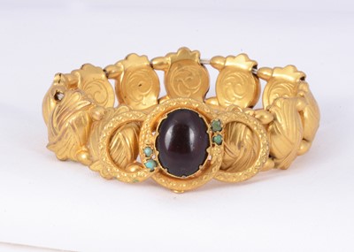 Lot 158 - A gilt metal "sweetheart" expanding panel link bracelet with bezel set cabochon centre