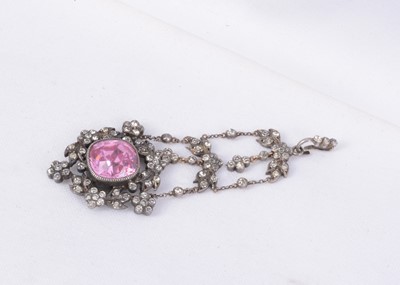 Lot 160 - An antique pink & colourless paste three tier white metal drop pendant