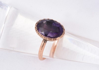 Lot 163 - An antique 9ct gold mavue foil backed stone set dress ring