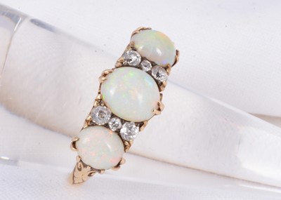 Lot 164 - A 18ct gold opal & diamond carved half hoop dress ring