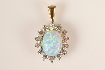 Lot 202 - A 9ct gold synetic opal & gem set cluster pendant