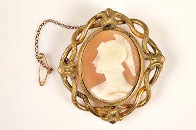 Lot 207 - An antique pinchbeck carved shell Classical god cameo brooch