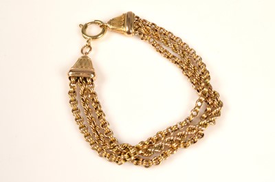 Lot 215 - A 9ct gold triple strand chain bracelet