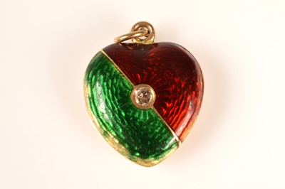 Lot 221 - An antique green & red guilloche enamelled heart locket with diamond
