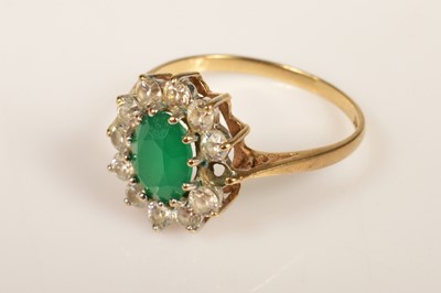 Lot 239 - A 9ct gold paste set cluster ring, green oval centre