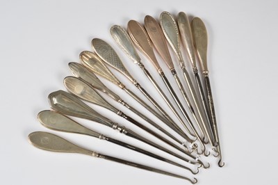 Lot 261 - A collection of thirteen silver handled button hooks