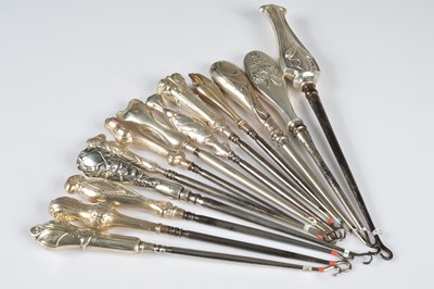 Lot 262 - A collection of thirteen silver handled button hooks