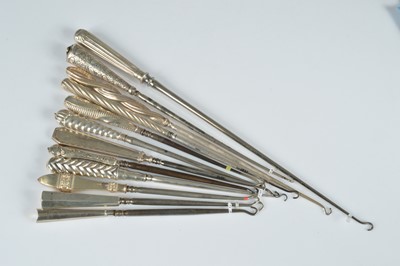 Lot 267 - A collection of twelve silver handled button hooks
