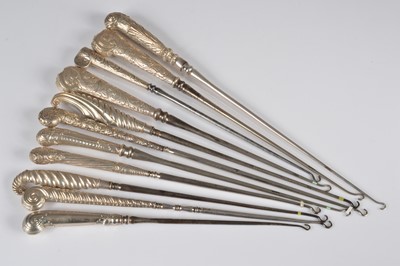 Lot 269 - A collection of eleven silver handled button hooks